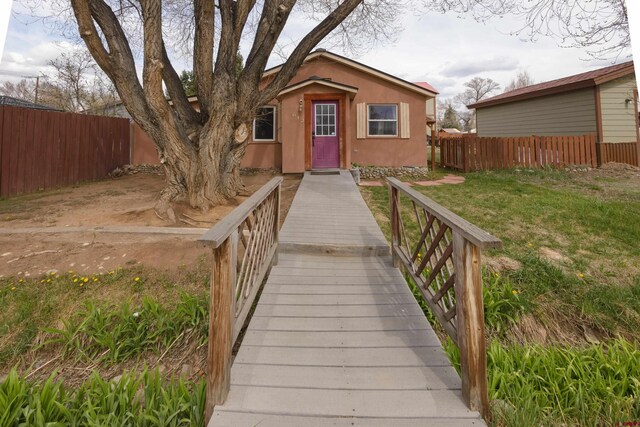 view of exterior entry with stucco siding