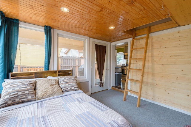 carpeted bedroom with wooden ceiling and recessed lighting