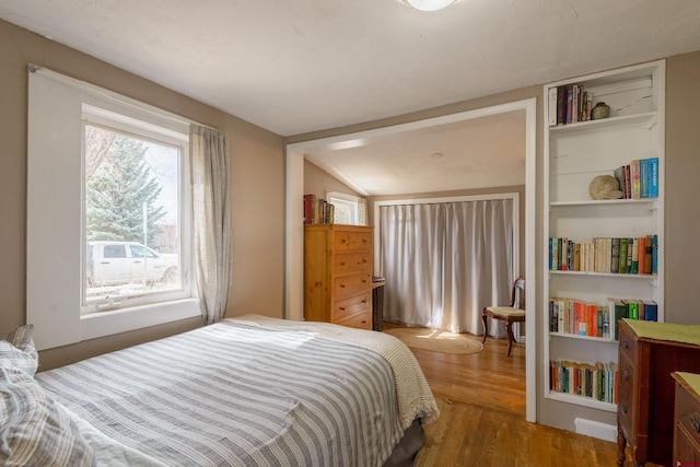bedroom with wood finished floors