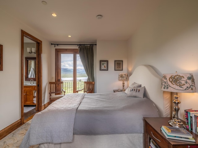 bedroom with access to exterior, wood finished floors, and recessed lighting