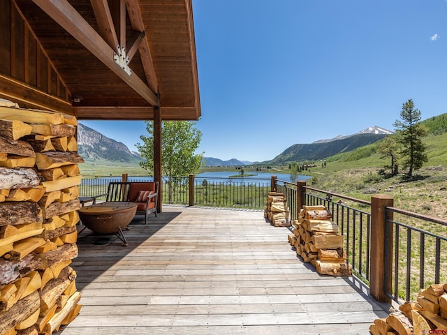 wooden deck featuring a mountain view