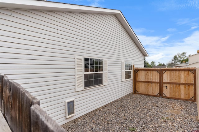 view of property exterior with fence
