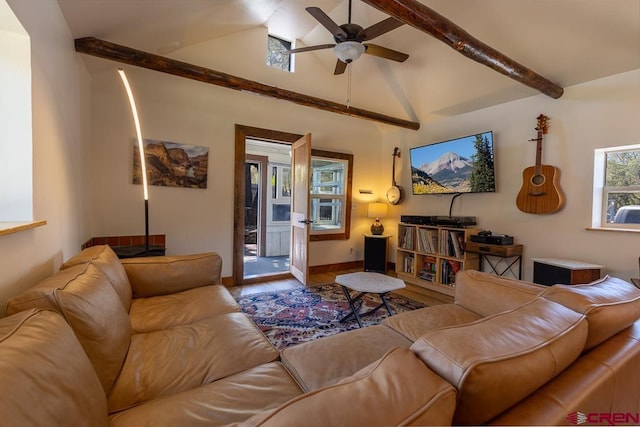 living room featuring wood finished floors, ceiling fan, and baseboards