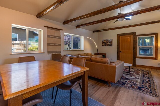 dining space featuring wood finished floors and ceiling fan