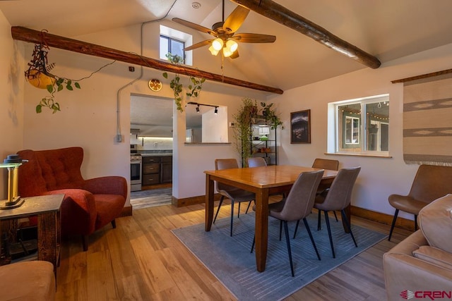 dining space featuring wood finished floors, ceiling fan, and baseboards