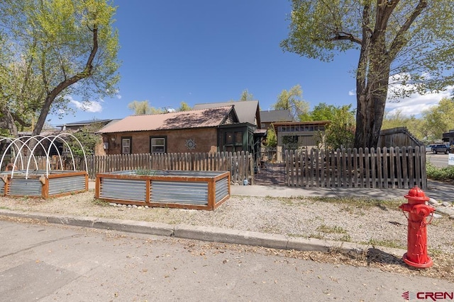 view of front of home featuring a vegetable garden