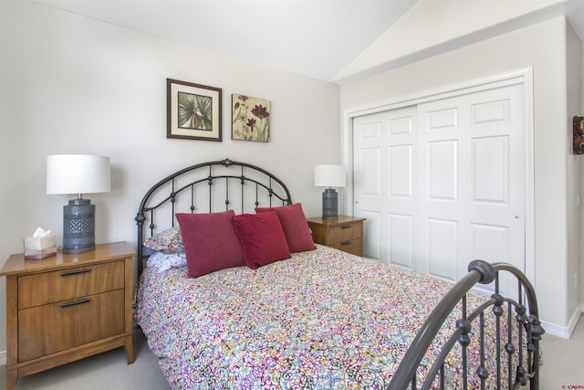 292 E Golf Pl Unit B, Pagosa Springs, CO 81147 - carpeted bedroom with vaulted ceiling, a closet, and baseboards