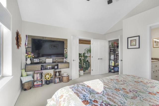292 E Golf Pl Unit B, Pagosa Springs, CO 81147 - carpeted bedroom featuring vaulted ceiling, connected bathroom, and a ceiling fan