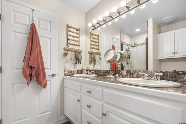 292 E Golf Pl Unit B, Pagosa Springs, CO 81147 - full bathroom featuring a stall shower and double vanity