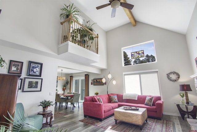 292 E Golf Pl Unit B, Pagosa Springs, CO 81147 - living room featuring high vaulted ceiling, wood finished floors, beamed ceiling, and a ceiling fan