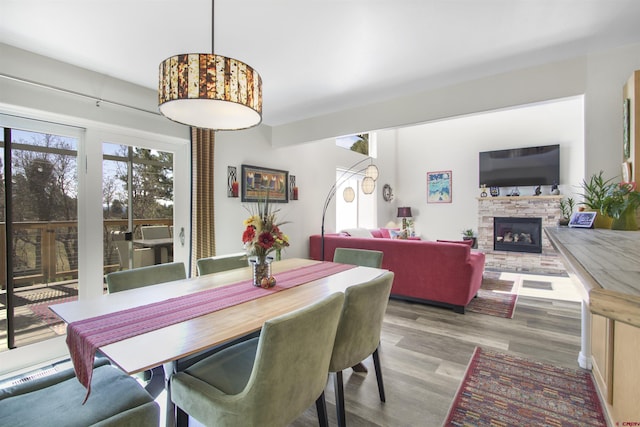 292 E Golf Pl Unit B, Pagosa Springs, CO 81147 - dining room with wood finished floors and a fireplace