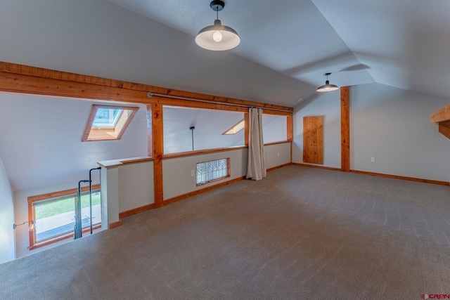 169 Camino Del Rio Unit 8, Gunnison, CO 81230 - bonus room featuring a skylight, carpet flooring, vaulted ceiling, and baseboards
