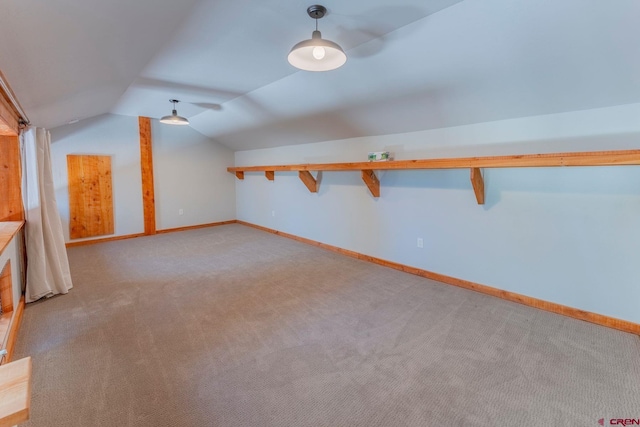 169 Camino Del Rio Unit 8, Gunnison, CO 81230 - additional living space featuring vaulted ceiling, carpet floors, and baseboards