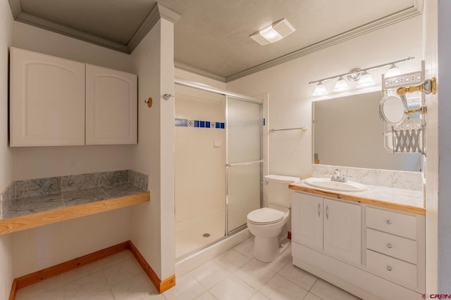 169 Camino Del Rio Unit 8, Gunnison, CO 81230 - full bath featuring crown molding, toilet, a stall shower, vanity, and tile patterned flooring