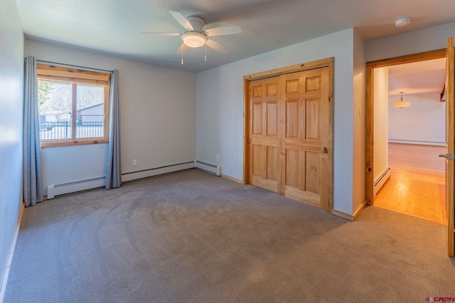 169 Camino Del Rio Unit 8, Gunnison, CO 81230 - unfurnished bedroom with carpet flooring, a baseboard heating unit, ceiling fan, and baseboards