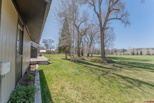 169 Camino Del Rio Unit 8, Gunnison, CO 81230 - view of green lawn with a deck