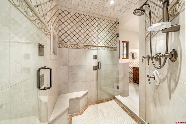 full bathroom featuring tile walls, a shower stall, and recessed lighting