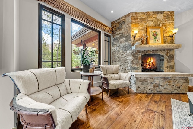 living area with a fireplace and hardwood / wood-style floors