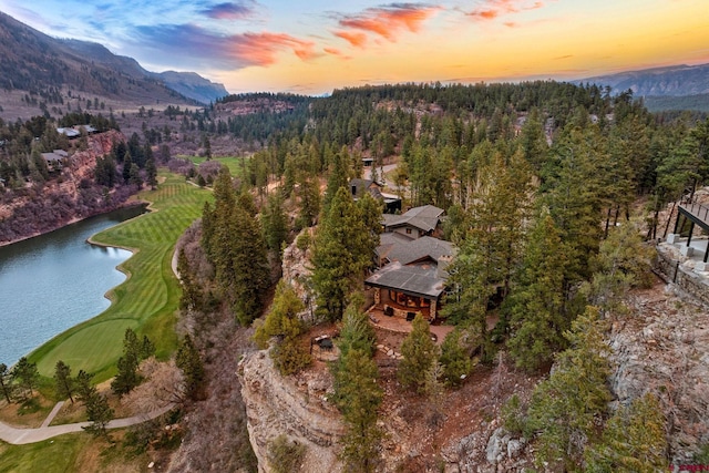 aerial overview of property's location with a water and mountain view and a golf club