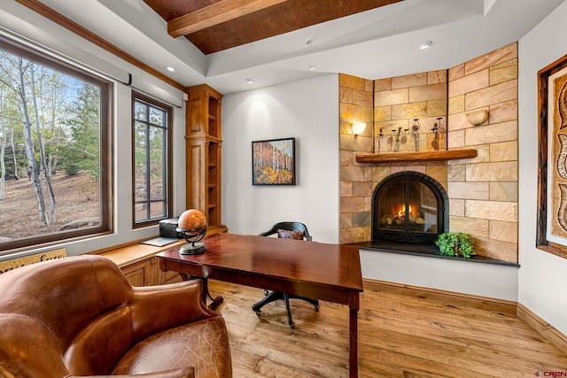 home office with wood finished floors, beamed ceiling, a large fireplace, recessed lighting, and baseboards