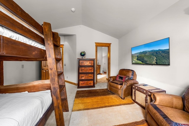 carpeted bedroom featuring lofted ceiling