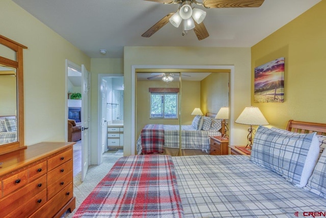 301 Talisman Dr Unit 4319, Pagosa Springs, CO 81147 - bedroom with a closet, light colored carpet, ceiling fan, and ensuite bathroom