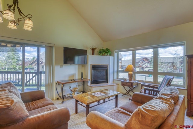 301 Talisman Dr Unit 4319, Pagosa Springs, CO 81147 - living area with plenty of natural light, a glass covered fireplace, and high vaulted ceiling