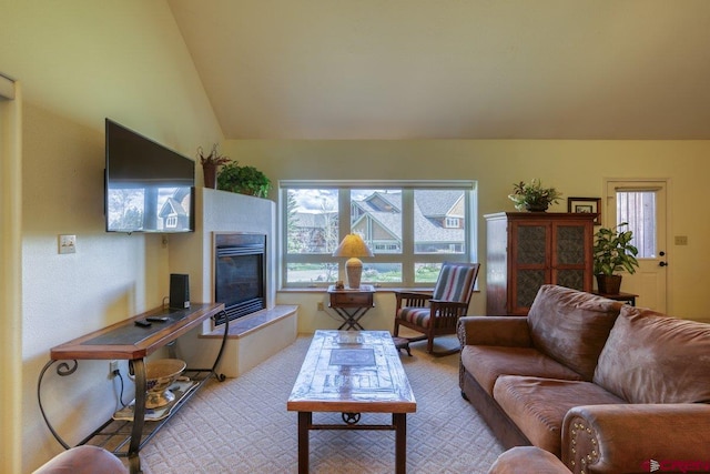 301 Talisman Dr Unit 4319, Pagosa Springs, CO 81147 - living area featuring a tile fireplace and lofted ceiling