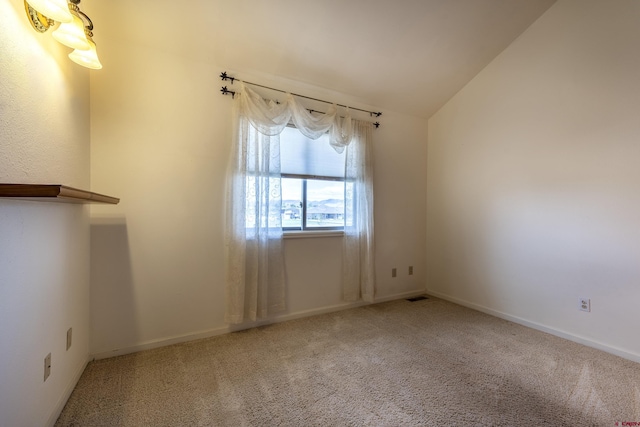 16303 6760th Rd, Montrose, CO 81401 - empty room with carpet, vaulted ceiling, and baseboards