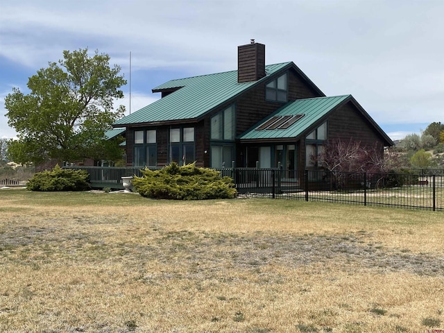 16303 6760th Rd, Montrose, CO 81401 - back of house with a chimney, a standing seam roof, and metal roof