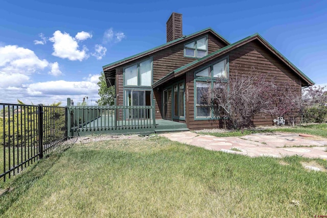 16303 6760th Rd, Montrose, CO 81401 - view of front of house with a chimney and a wooden deck