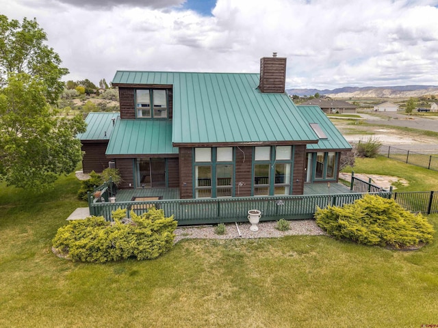 16303 6760th Rd, Montrose, CO 81401 - rear view of property with a standing seam roof, a chimney, and metal roof