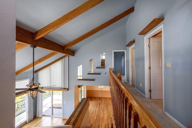 16303 6760th Rd, Montrose, CO 81401 - corridor with high vaulted ceiling, beamed ceiling, wood finished floors, an upstairs landing, and baseboards