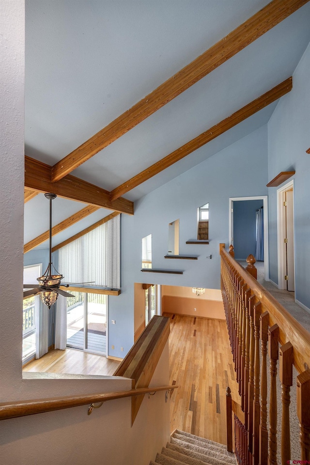 16303 6760th Rd, Montrose, CO 81401 - stairway with beamed ceiling, wood finished floors, a chandelier, and high vaulted ceiling