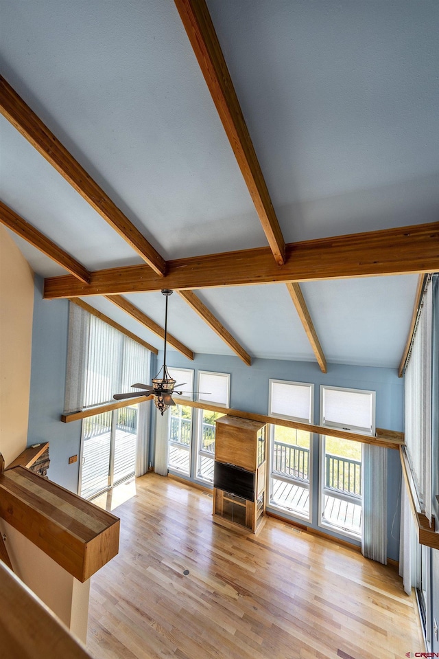 16303 6760th Rd, Montrose, CO 81401 - unfurnished living room featuring beamed ceiling and wood finished floors