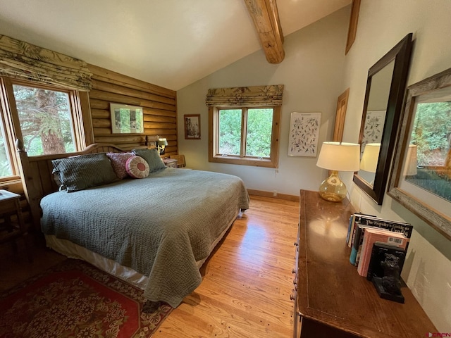 209 Deer Path Ln, Almont, CO 81230 - bedroom featuring rustic walls, light wood-style flooring, multiple windows, and baseboards