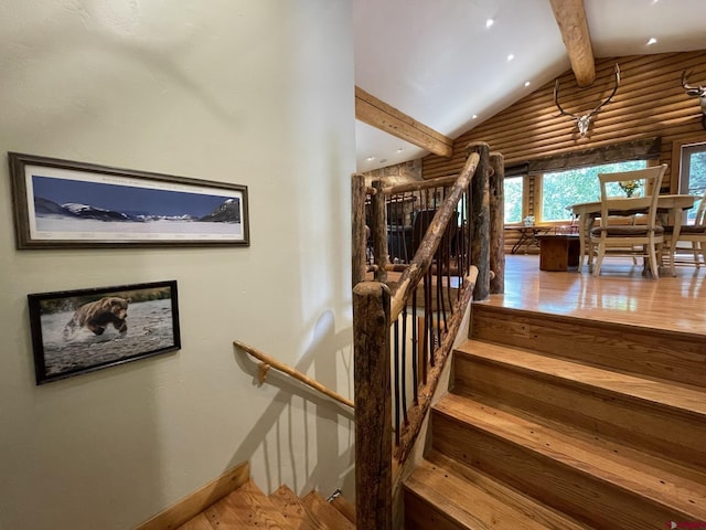 209 Deer Path Ln, Almont, CO 81230 - staircase featuring wood finished floors, baseboards, log walls, and recessed lighting
