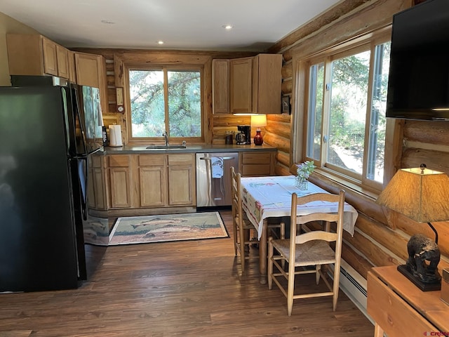 209 Deer Path Ln, Almont, CO 81230 - kitchen with freestanding refrigerator, dishwasher, rustic walls, healthy amount of natural light, and dark wood-type flooring