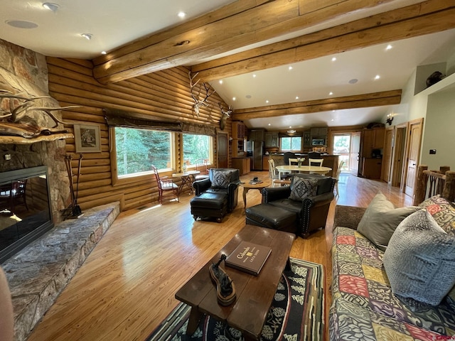 209 Deer Path Ln, Almont, CO 81230 - living room featuring light wood-type flooring, recessed lighting, rustic walls, and a fireplace