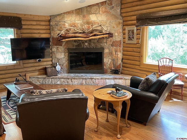 209 Deer Path Ln, Almont, CO 81230 - living room featuring rustic walls, wood finished floors, and a fireplace