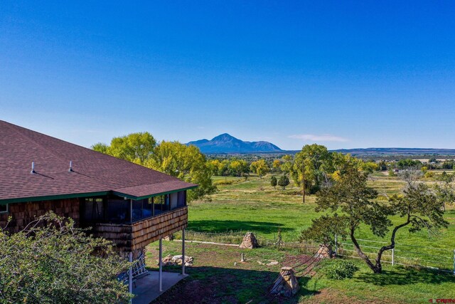 14120 Rd 26, Dolores, CO 81323 - view of yard with a sunroom and a mountain view