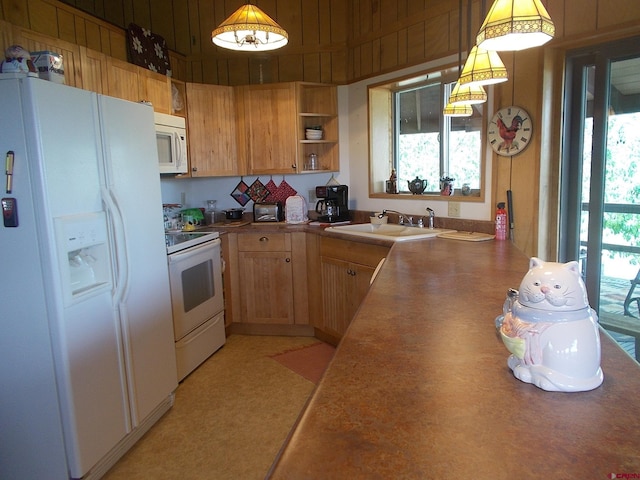 14120 Rd 26, Dolores, CO 81323 - kitchen featuring white appliances, a sink, open shelves, and hanging light fixtures