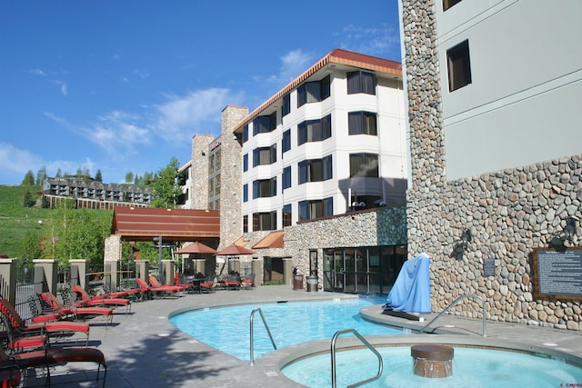community pool with a patio