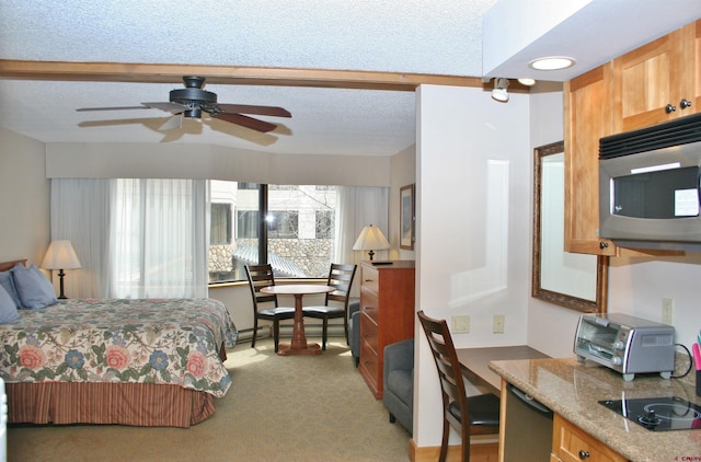 bedroom featuring light colored carpet and a textured ceiling
