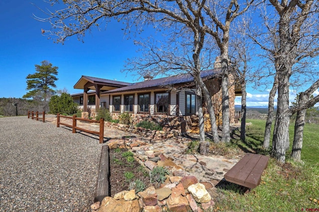 1520 Carino Pl, Pagosa Springs, CO 81147 - back of property featuring a chimney