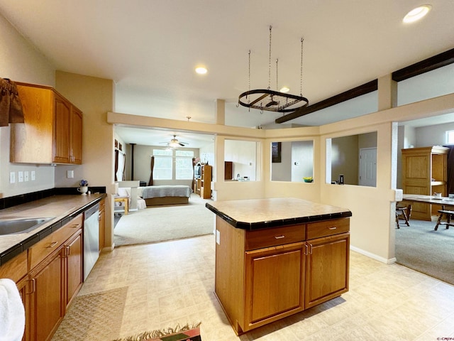 360 Forest Hill Rd, Ridgway, CO 81432 - kitchen featuring light carpet, stainless steel dishwasher, brown cabinets, a kitchen island, and recessed lighting