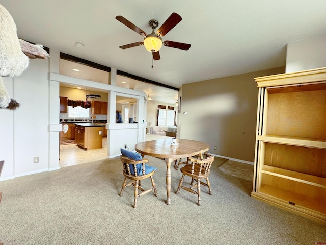 360 Forest Hill Rd, Ridgway, CO 81432 - dining area featuring a ceiling fan, light carpet, and baseboards