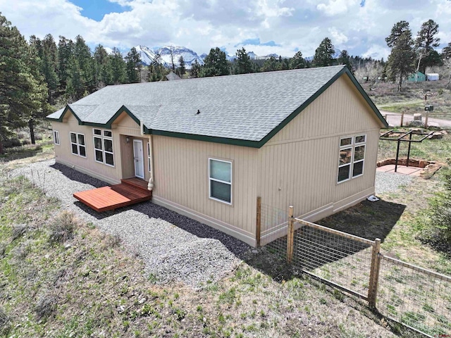 360 Forest Hill Rd, Ridgway, CO 81432 - view of front of home featuring roof with shingles and fence