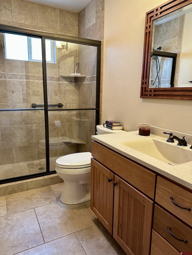 full bathroom with a shower stall, toilet, and vanity