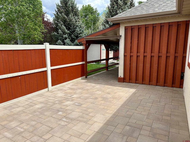 view of patio / terrace featuring fence